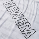 スリーブレス テックTシャツ タイダイ Allover Wordmark Logo ホワイト | パフォーマンスアパレル | NEW ERA ニューエラ公式オンラインストア